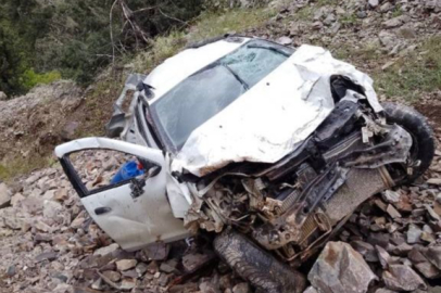 Taklalar atarak uçuruma yuvarlanan otomobilden yaralı kurtuldu